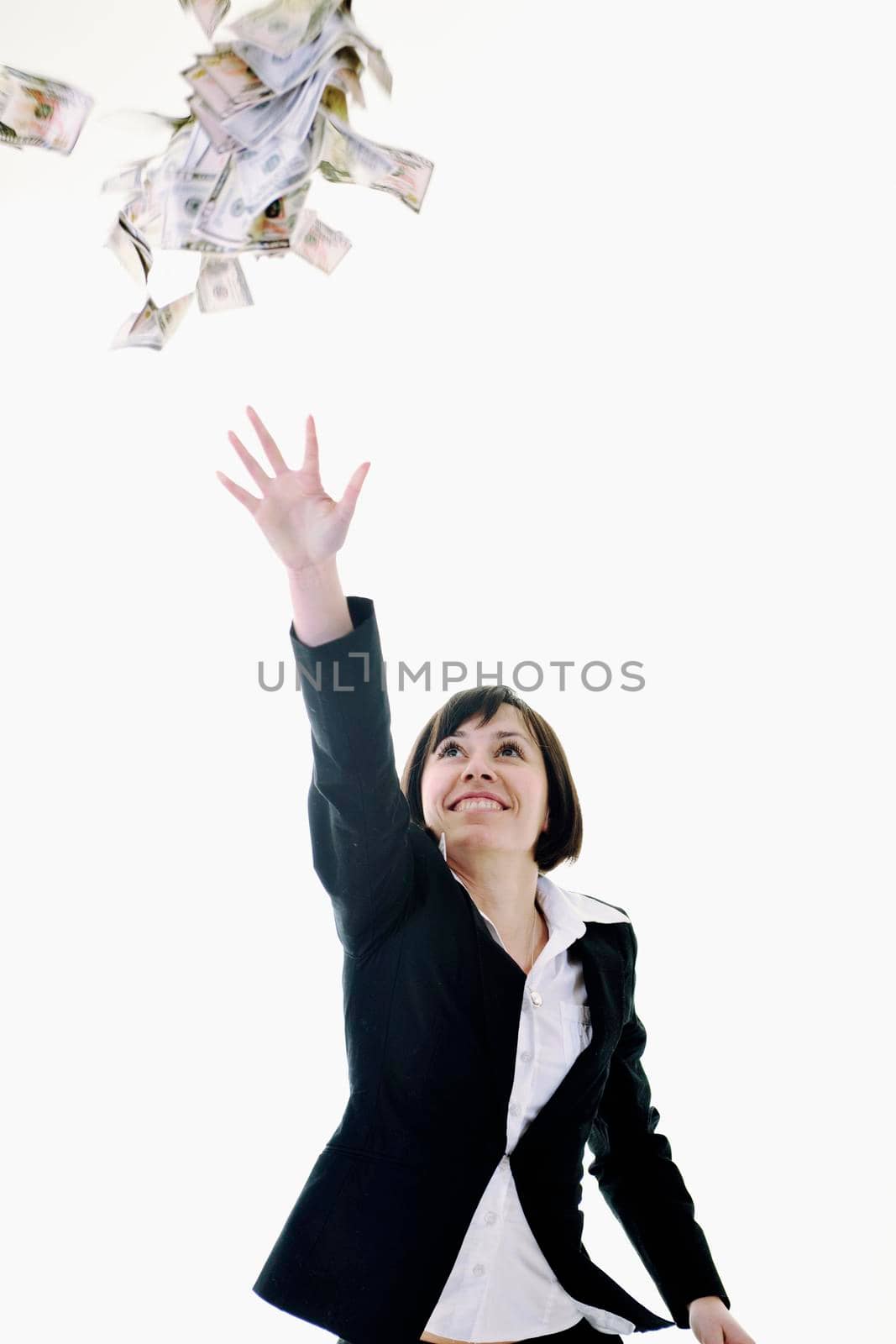 happy young business woman isolated on white playing with dollars money and representing success in finance