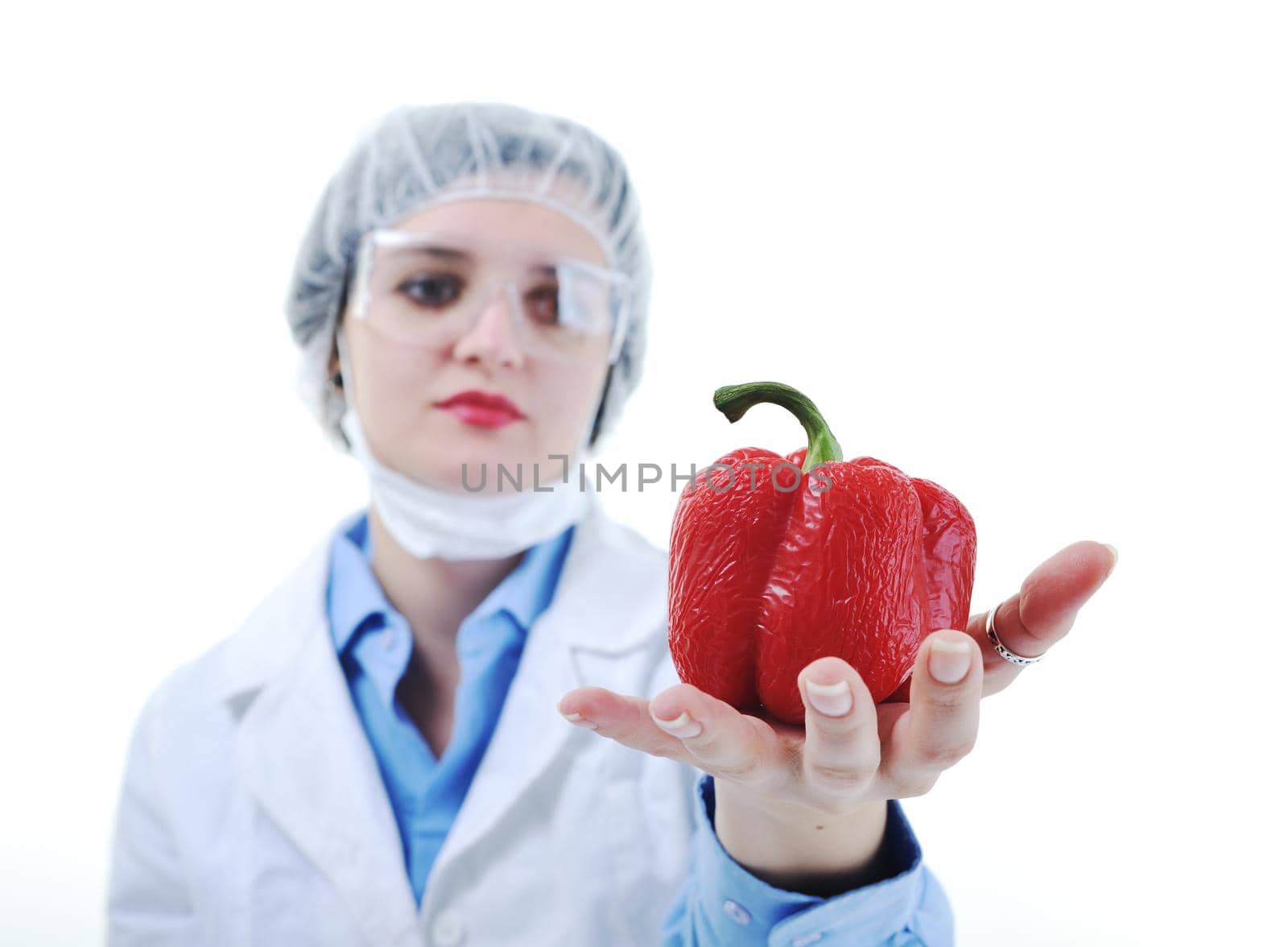 isolated on white young nurse doctor woman with red vegetable food papper representing bio food concept 