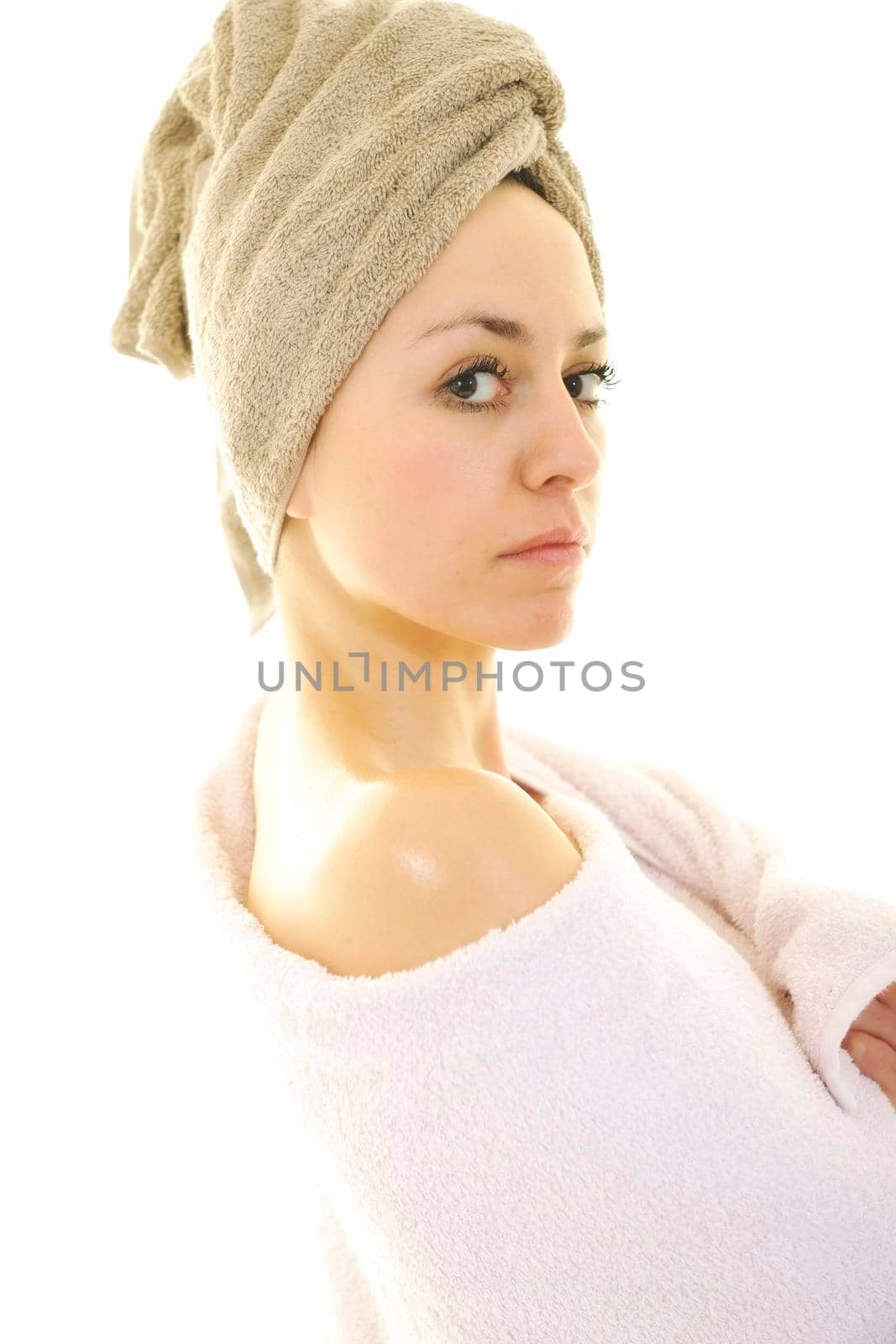 beautiful young woman portrait with towel on head isolated on white