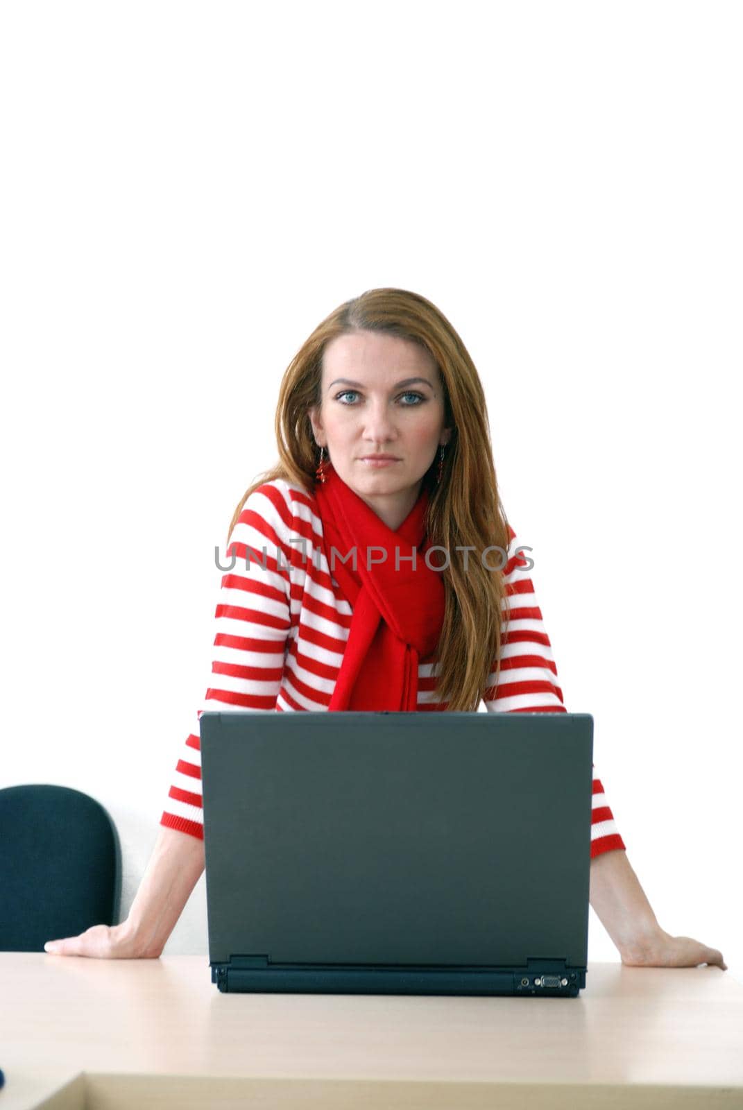 woman in red working on laptop at bright  office