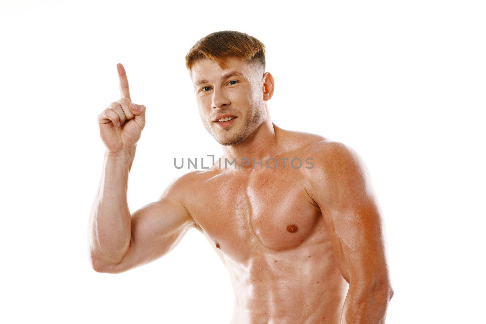 athletic man pumped up press gestures with hands posing fitness. High quality photo
