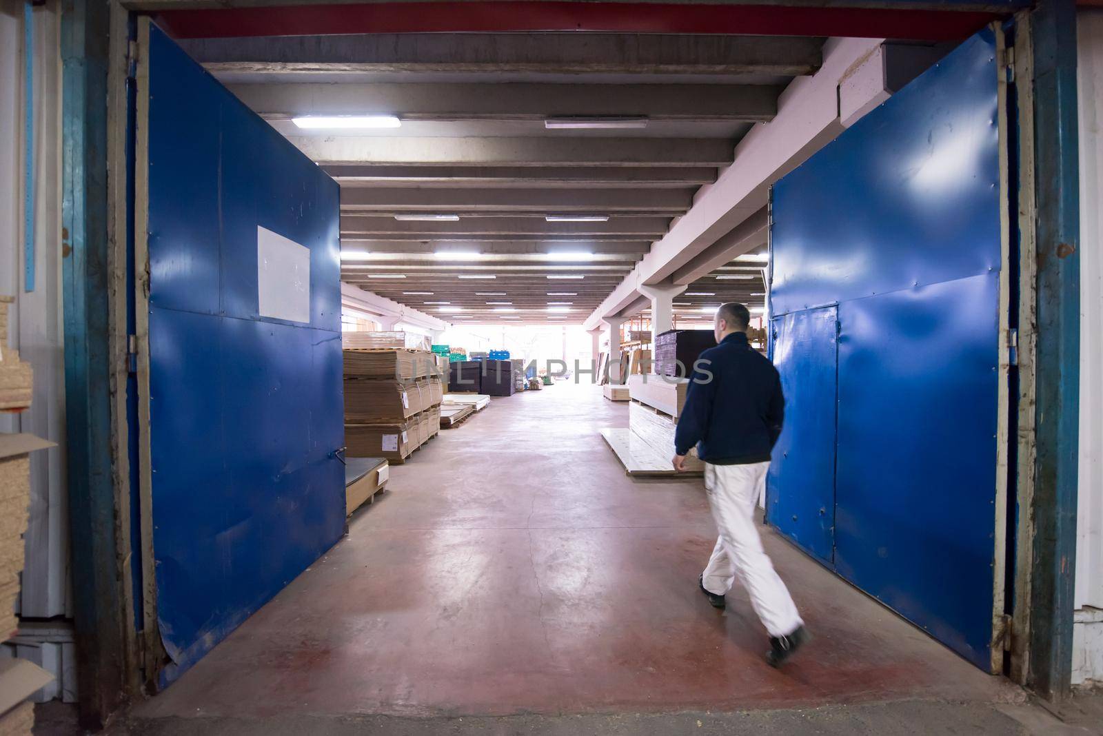 carpenter walking through factory by dotshock