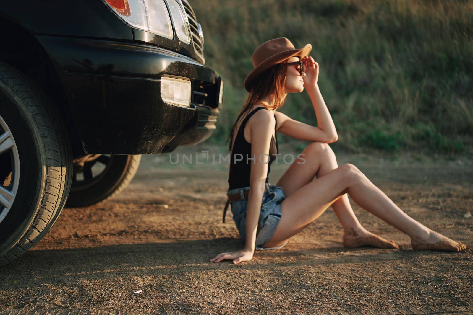 woman in sunglasses near car travel summer vacation landscape. High quality photo