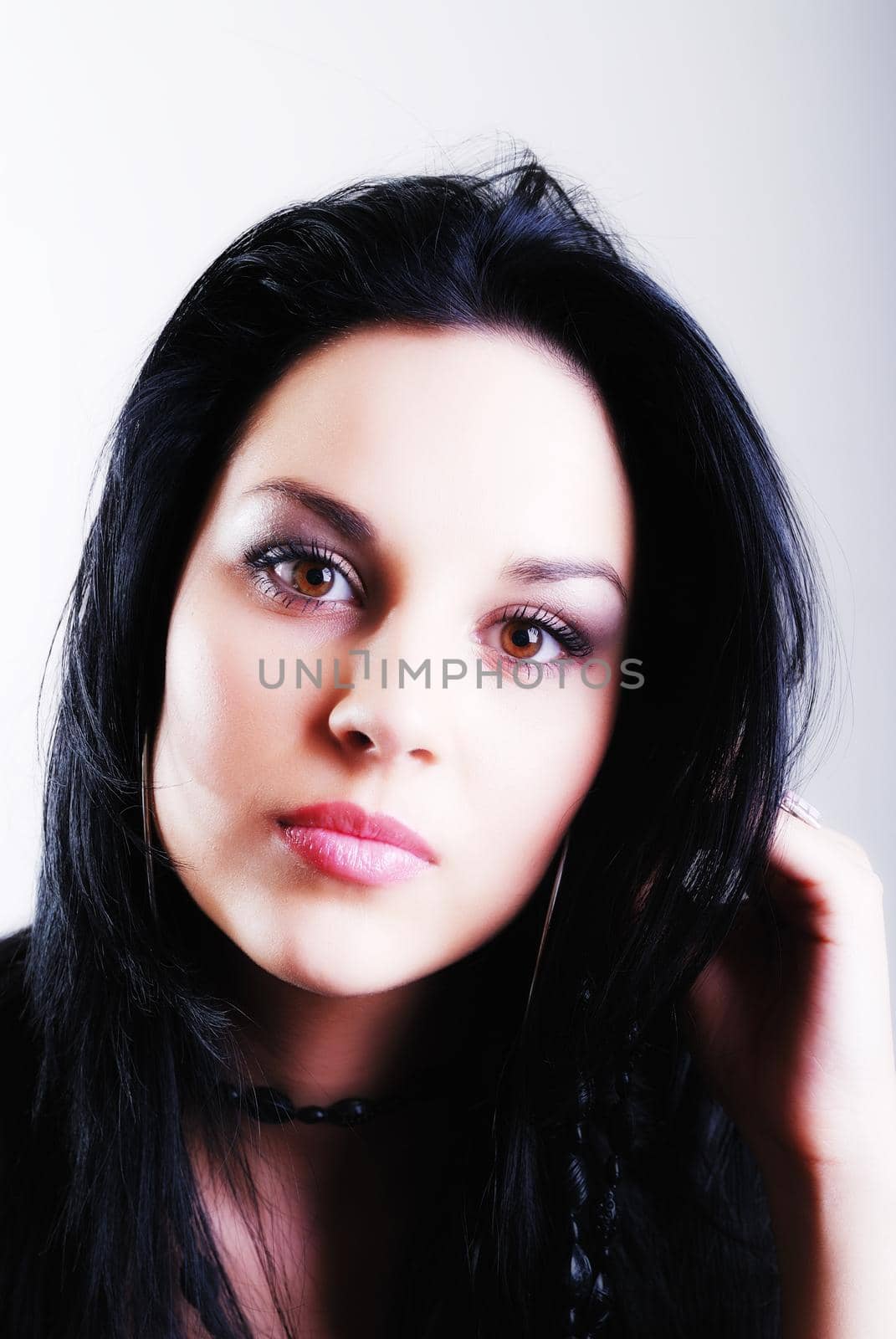 one brunette woman posing in studio 