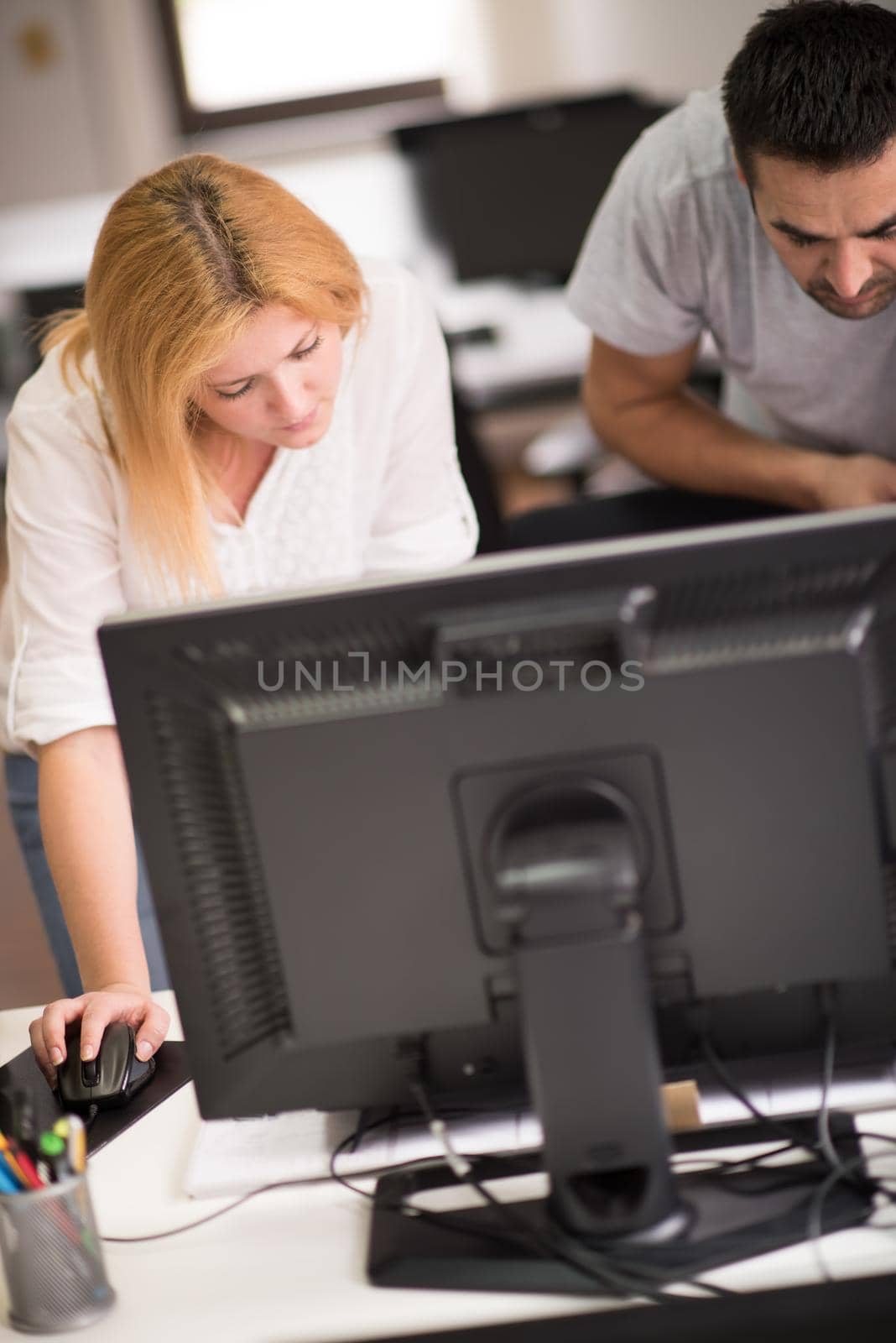 young designers in the creative office at the wooden furniture manufacture