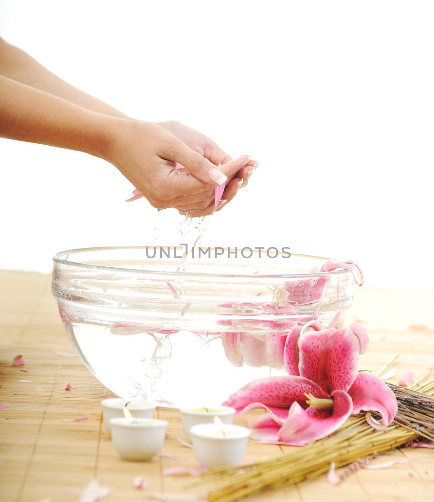 hand spa and beauty treatment with aroma and flowers in water