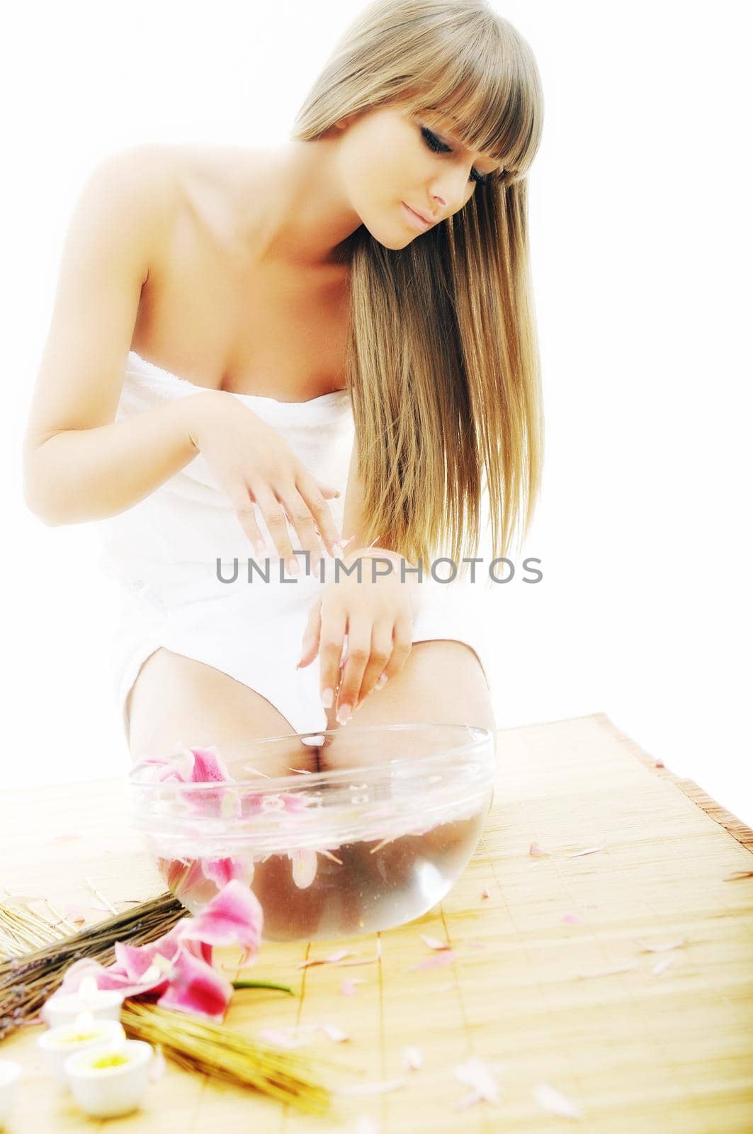 hand spa and beauty treatment with aroma and flowers in water