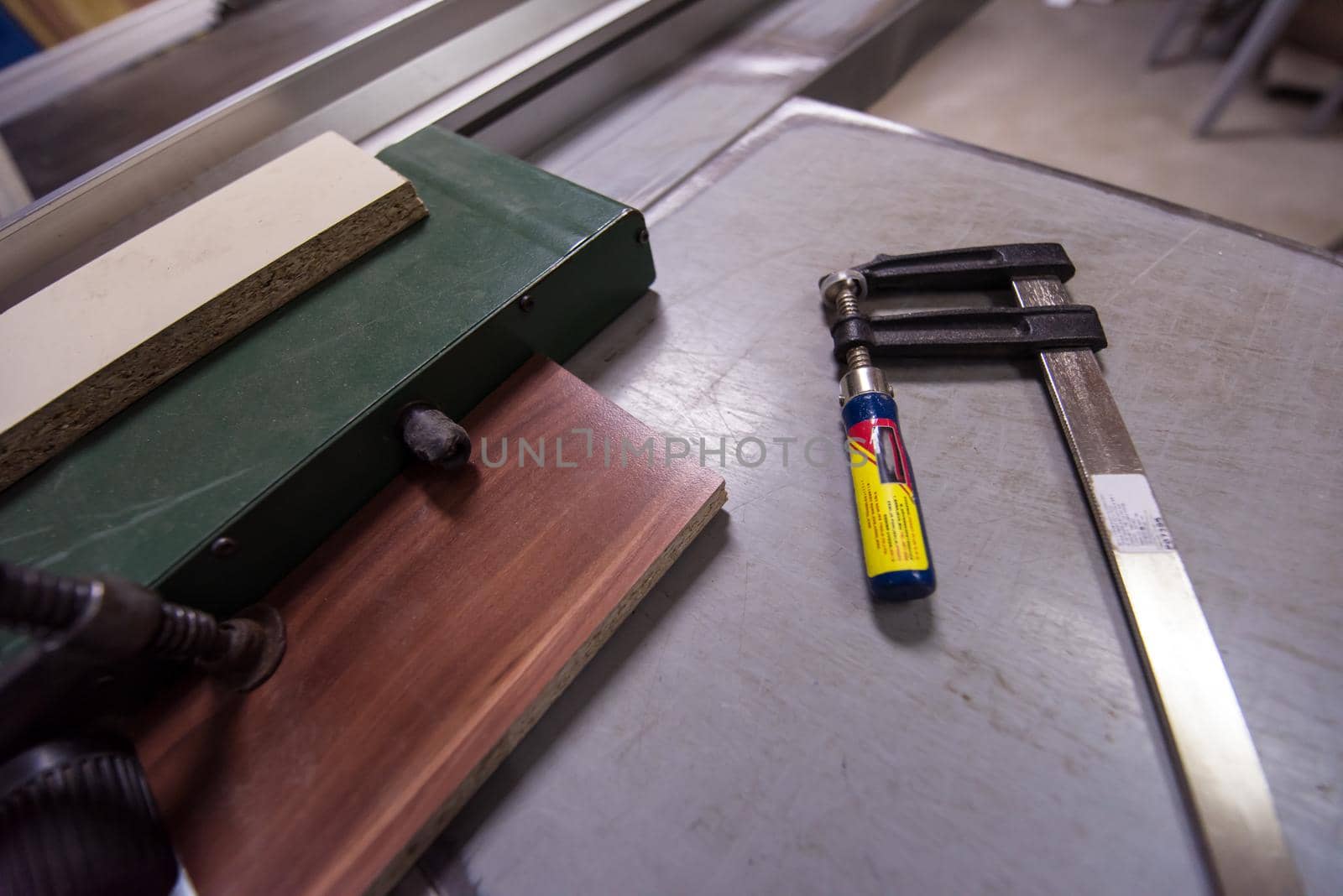 clamp and ruler tools on desk in factory for the production of wooden furniture