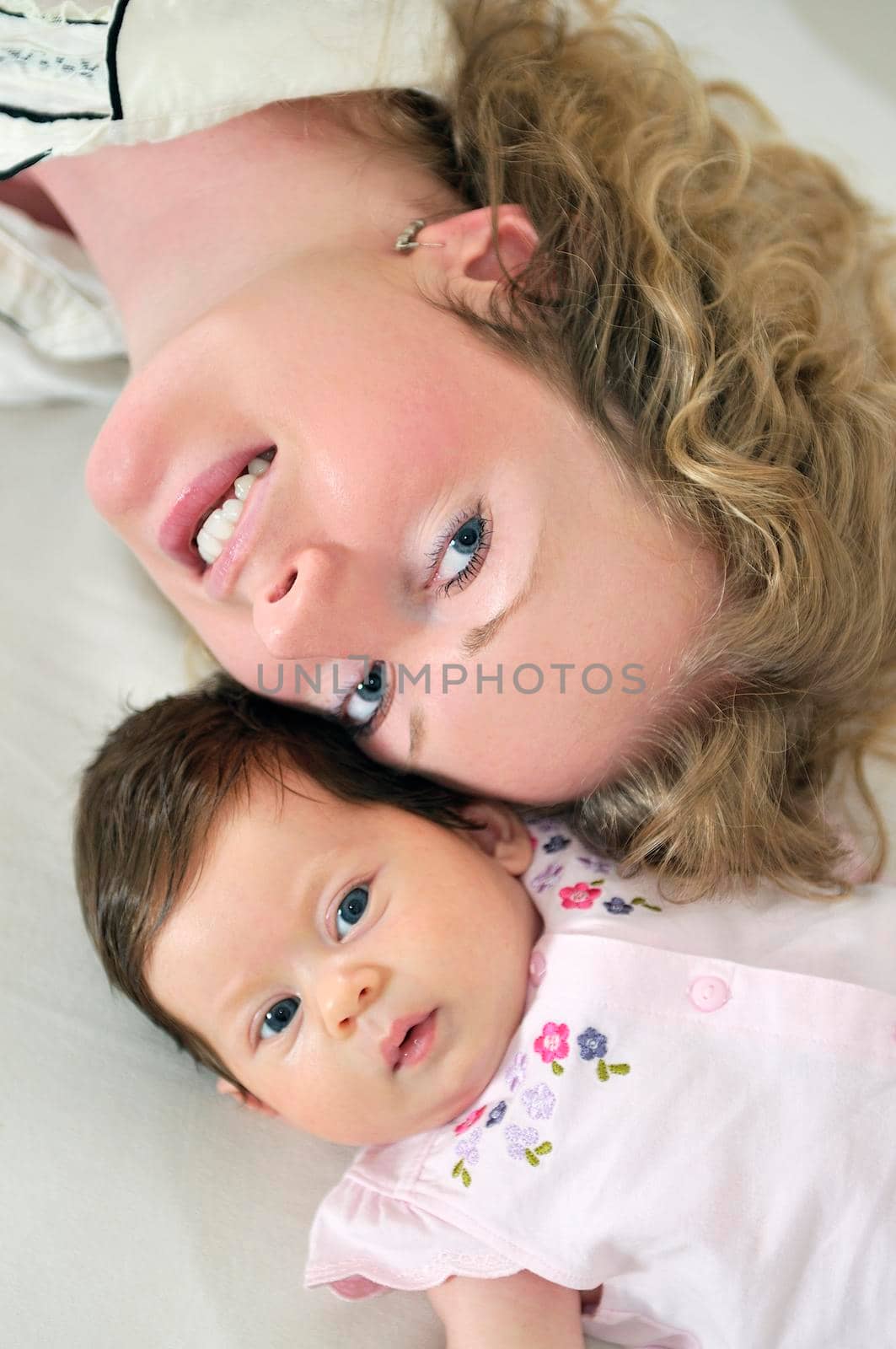 beautiful blonde young mother and cute baby