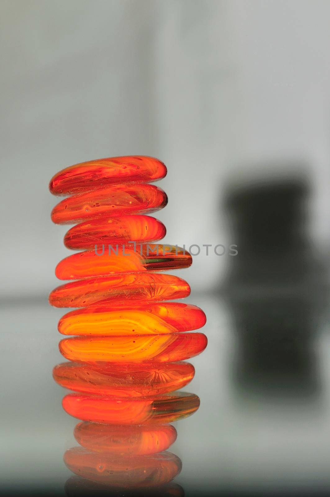 isolated wet zen stones with splashing  water drops   by dotshock