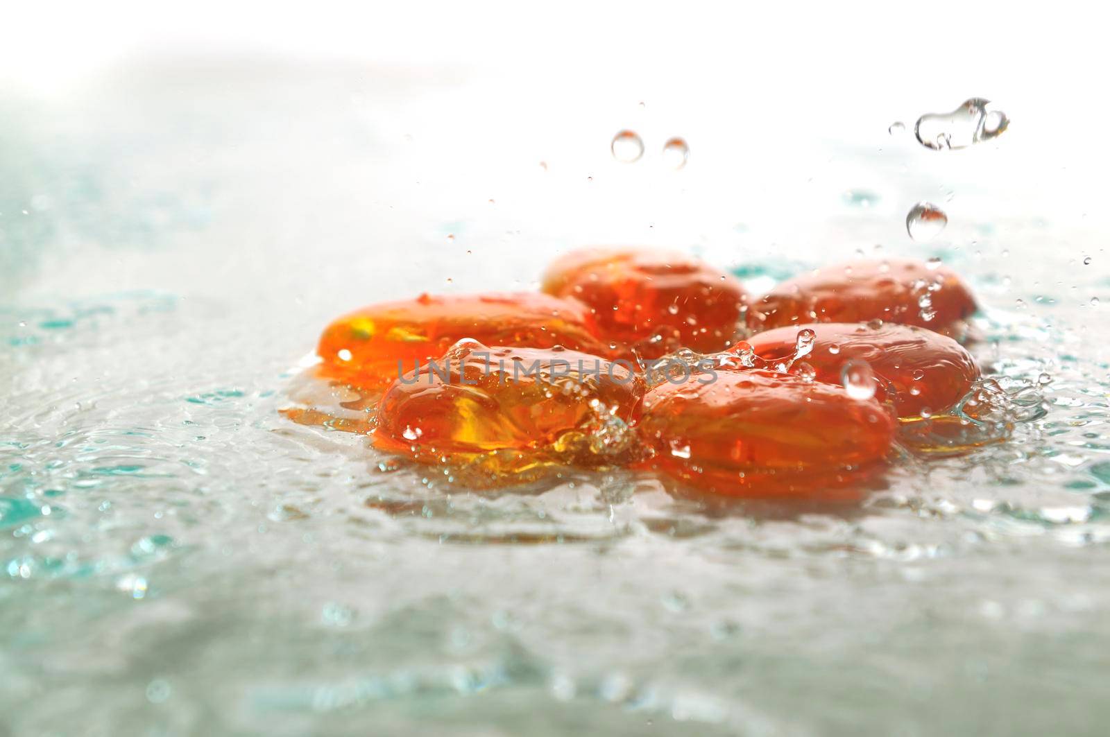 isolated wet zen stones with splashing  water drops  representing concept of natural balance and perfect harmony