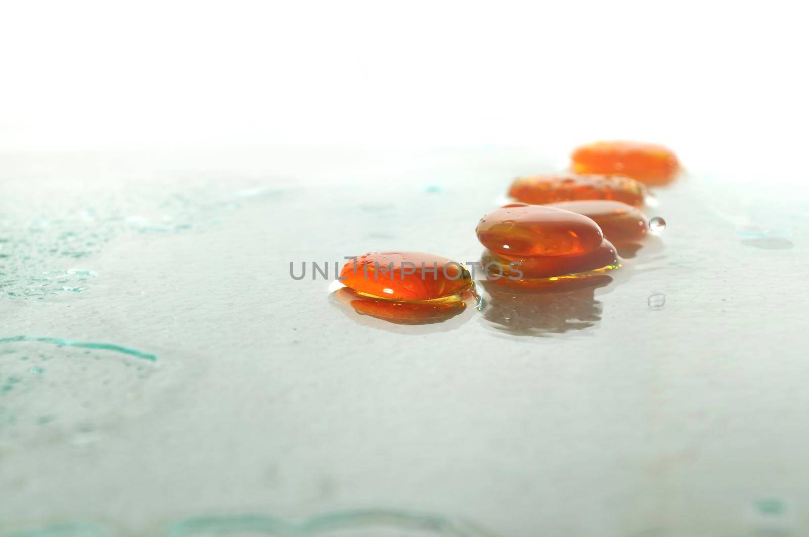 isolated wet zen stones with splashing  water drops by dotshock