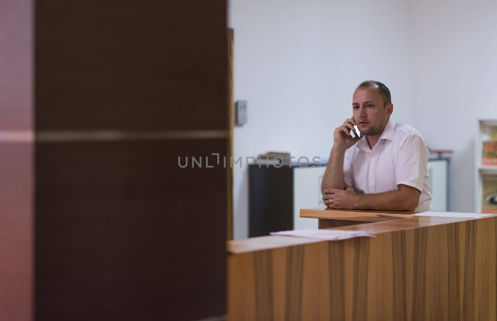 Portrait of an independent designer in his furniture manufacturing workshop, looking relaxed and confident