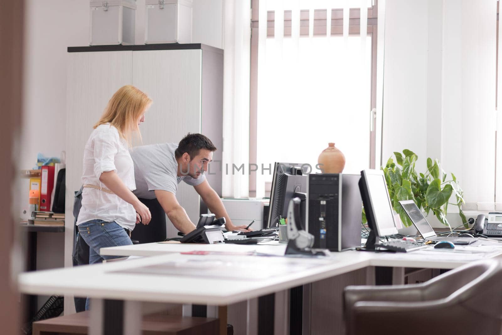 young designers in the creative office at the wooden furniture manufacture