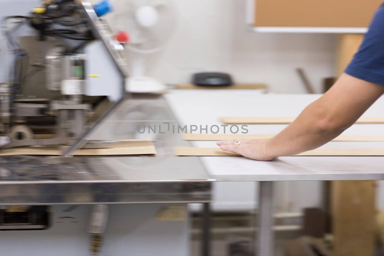 engineer in front of wood cutting machine by dotshock