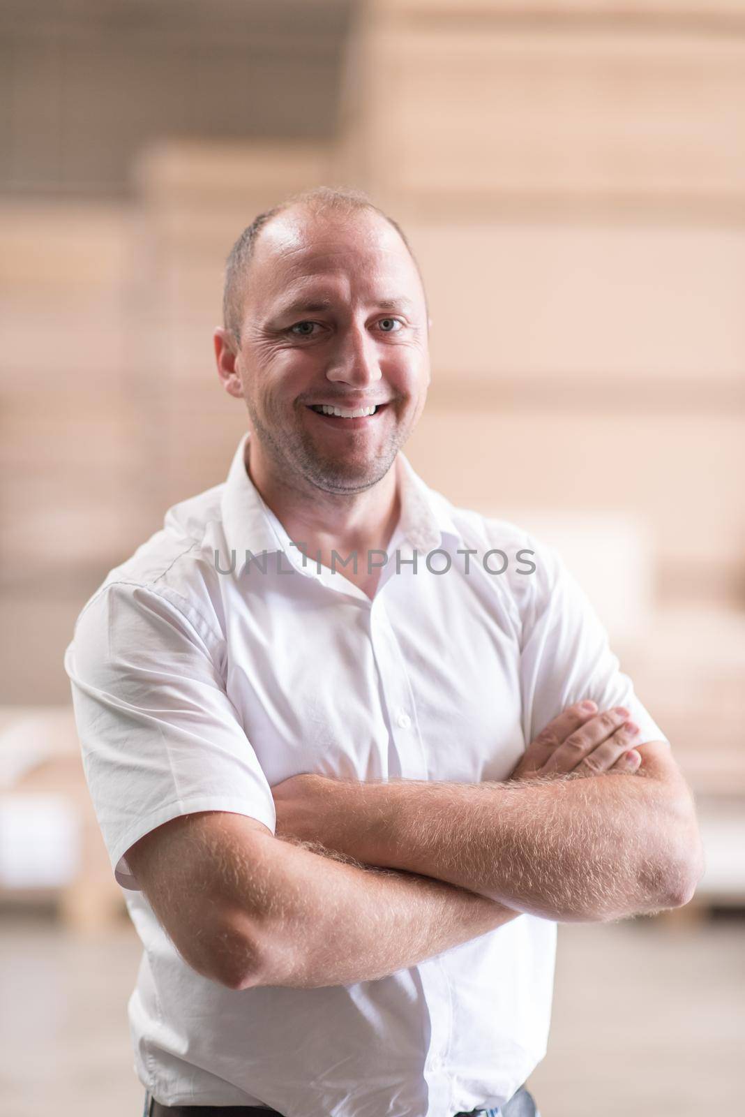 designer in his furniture manufacturing workshop by dotshock