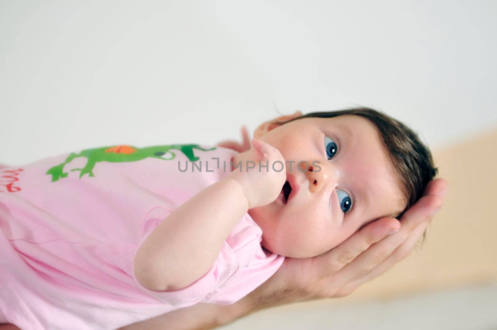 indoor portrait with happy young famil and  cute little babby 