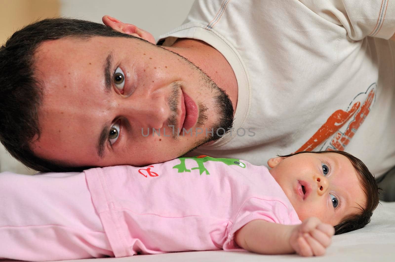 indoor portrait with happy young famil and  cute little babby 