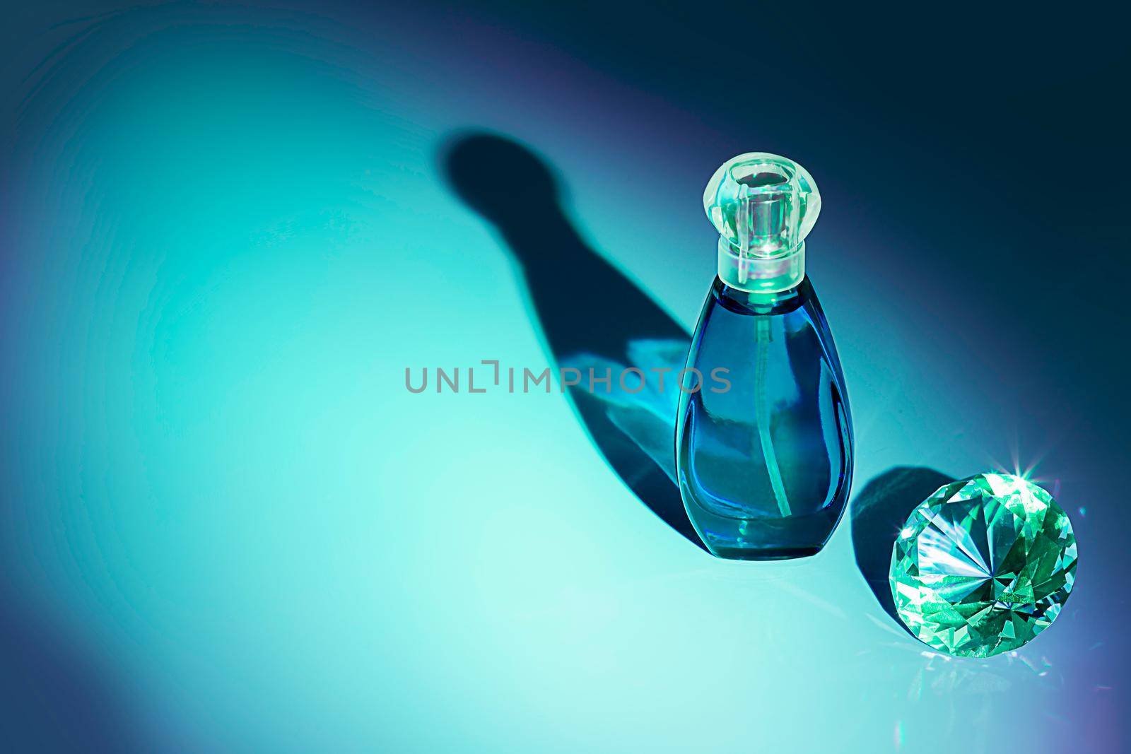 Perfume bottles studio shot on colored background with reflection. by galinasharapova