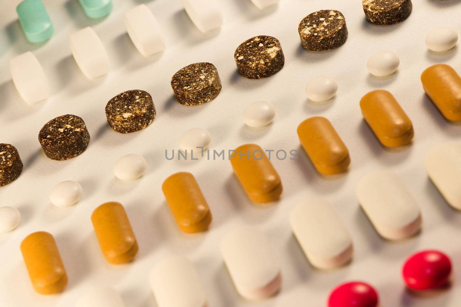 Bad pill row in an abstract pattern of various prescription drug pills and tablets