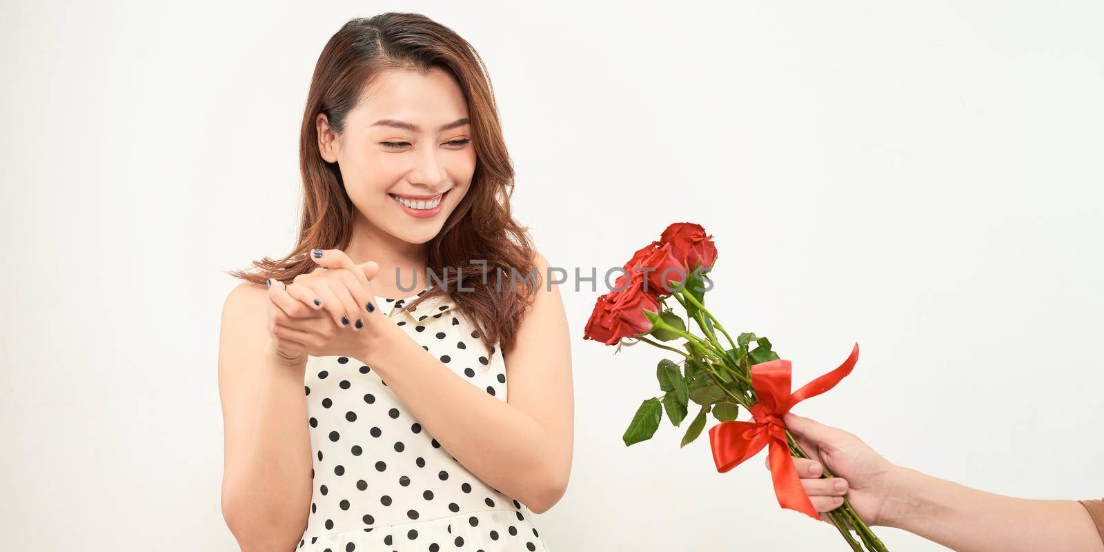 man giving rose flowers to girl by makidotvn