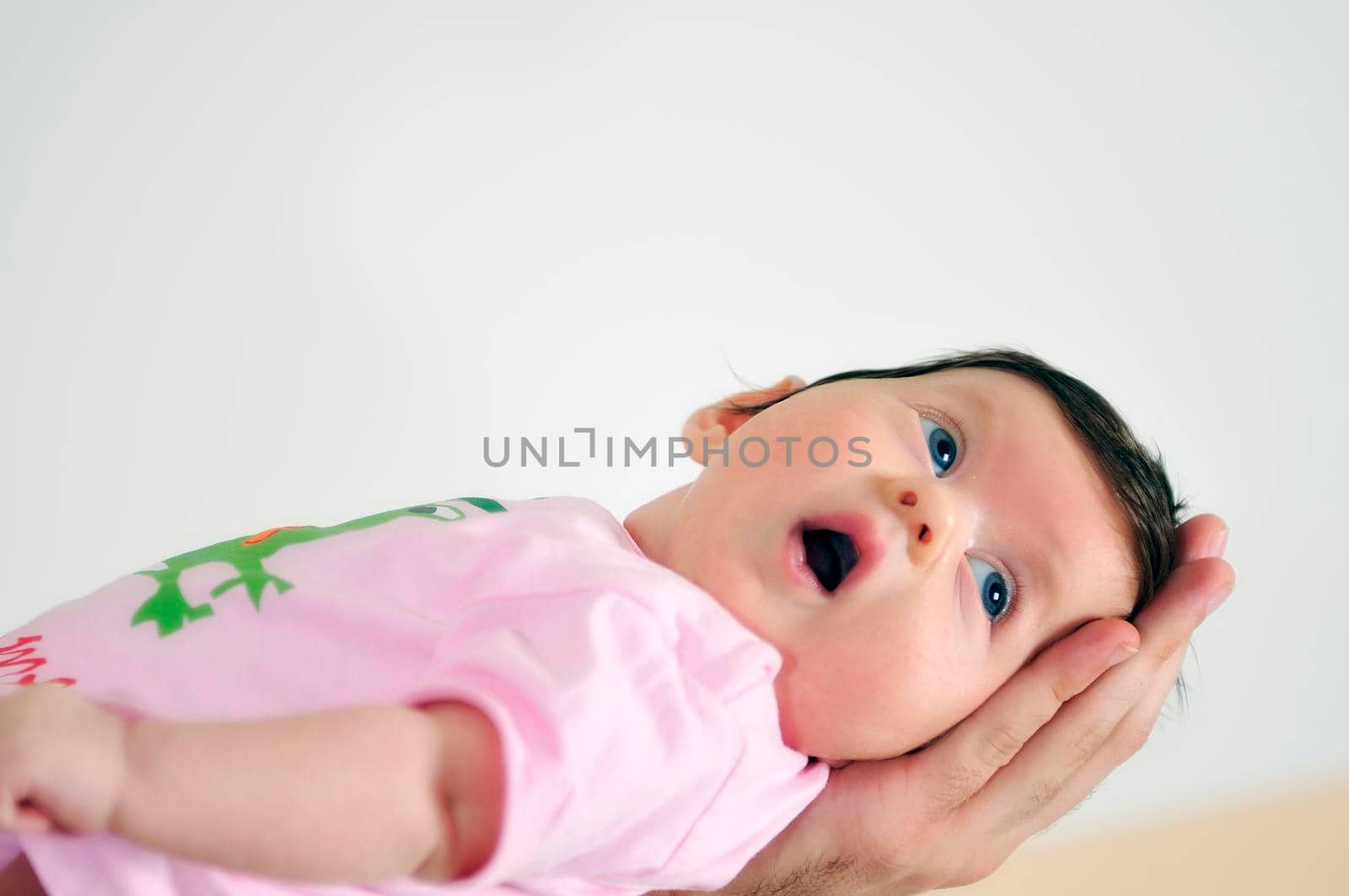 indoor portrait with happy young famil and  cute little babby 