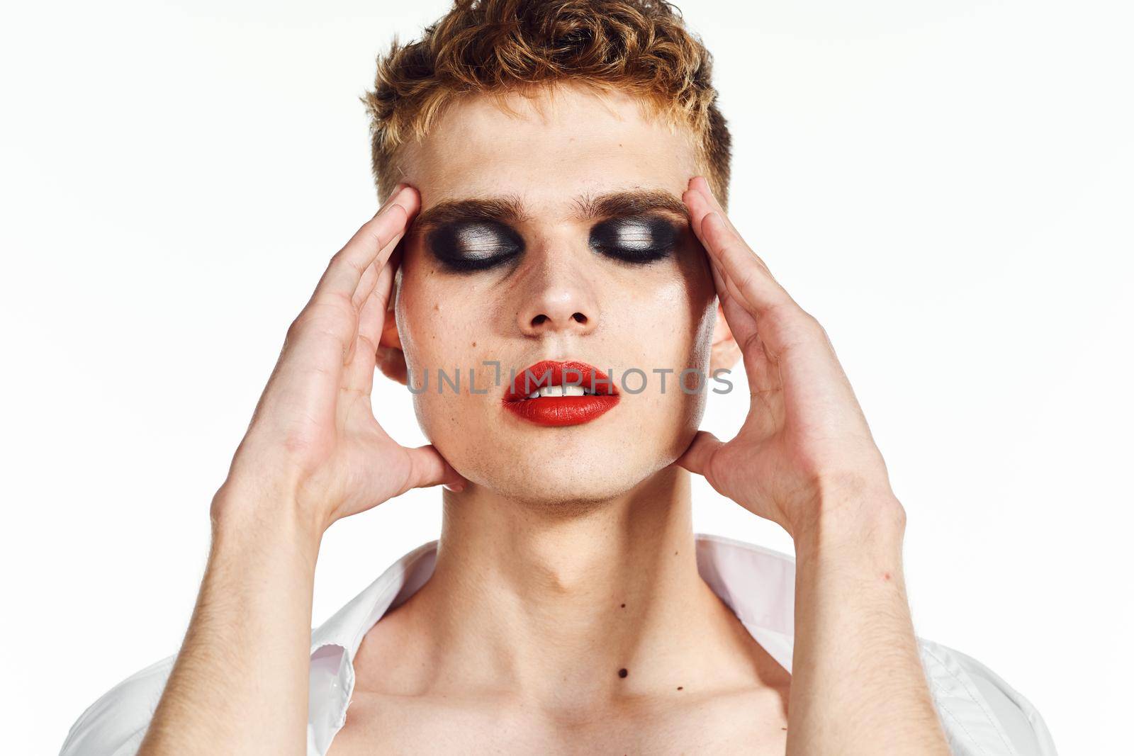 male transgender female makeup fashion posing studio. High quality photo