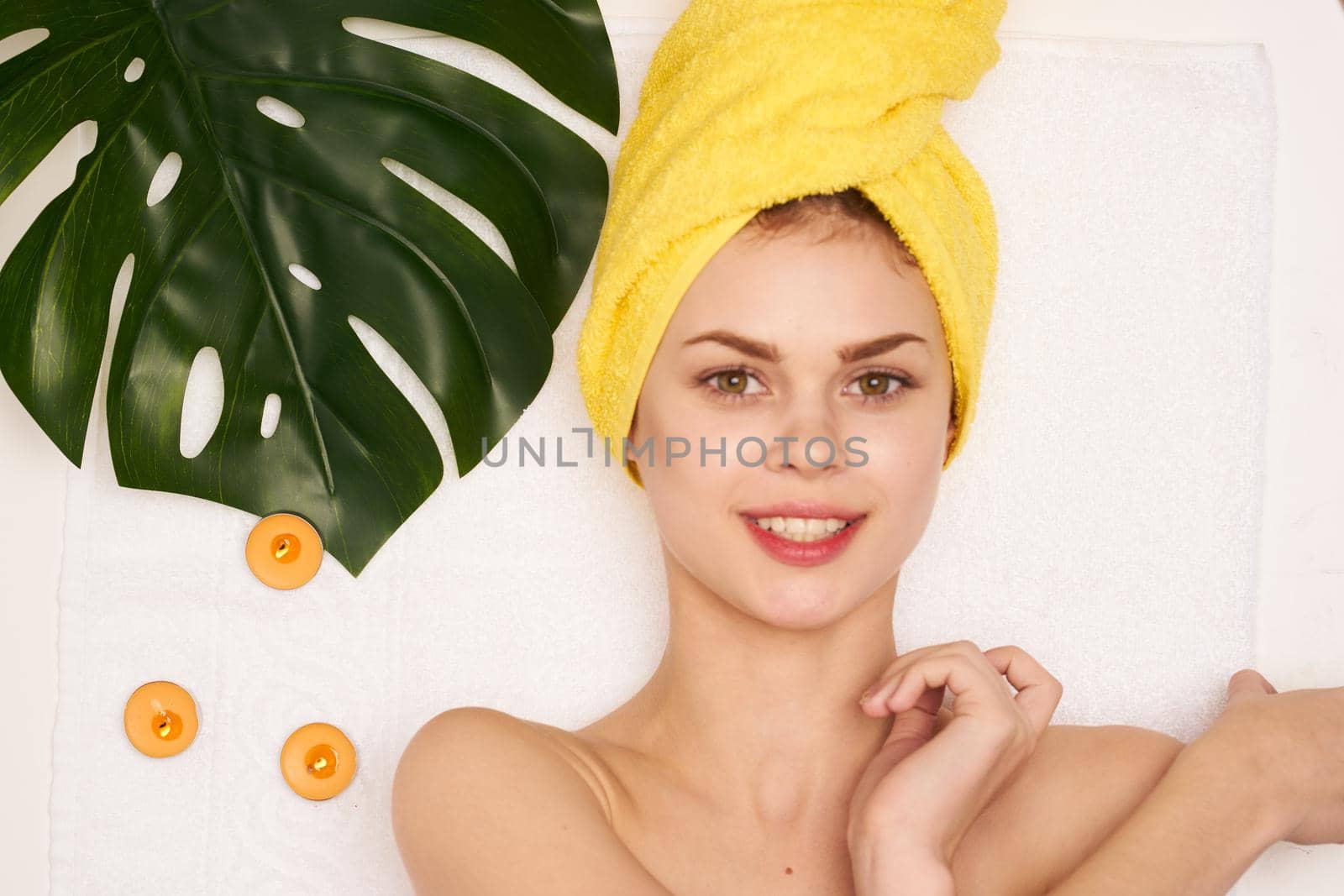 pretty woman spa treatments cosmetics beauty saloon light background. High quality photo