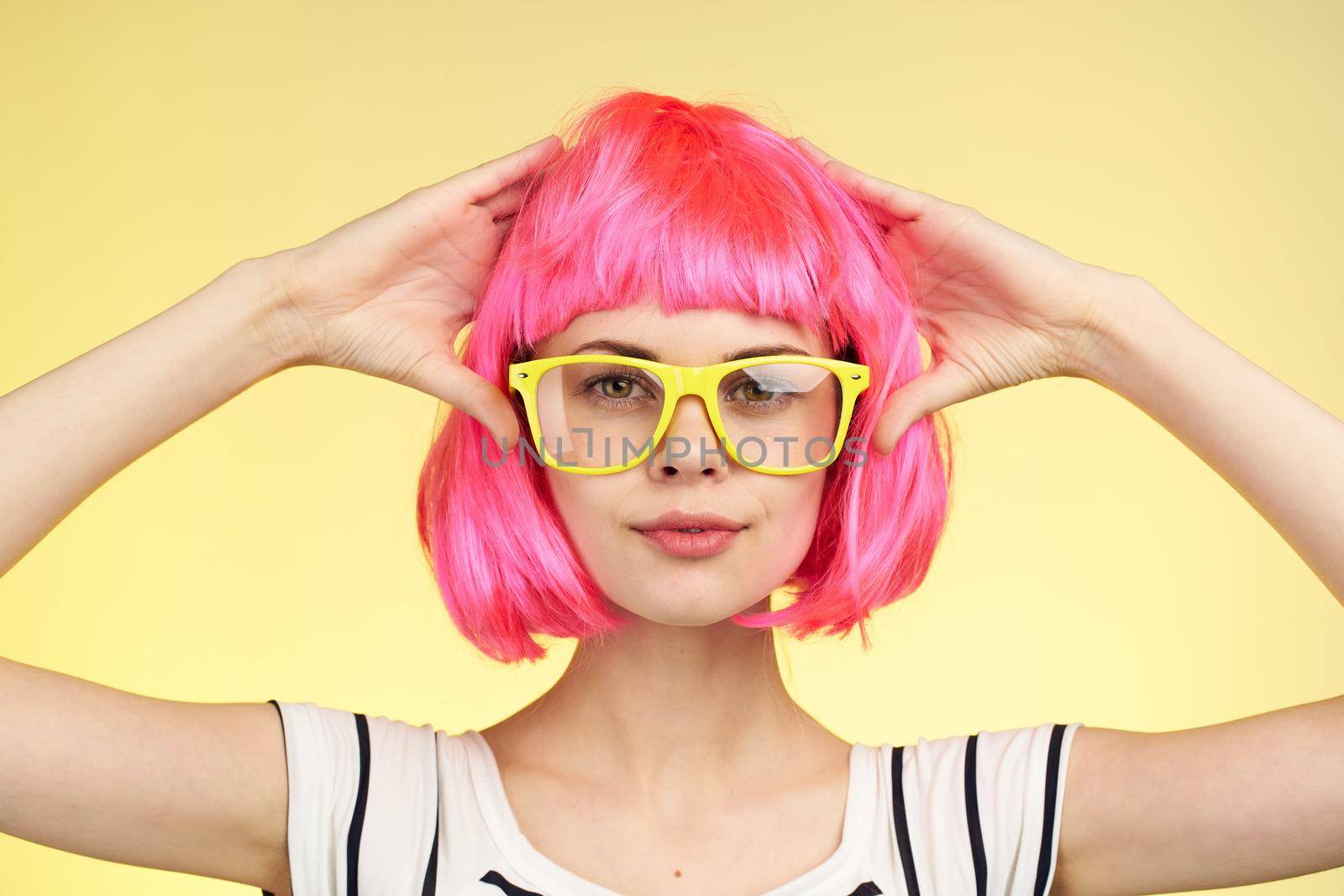 glamorous woman with pink hair fashion glasses home model. High quality photo