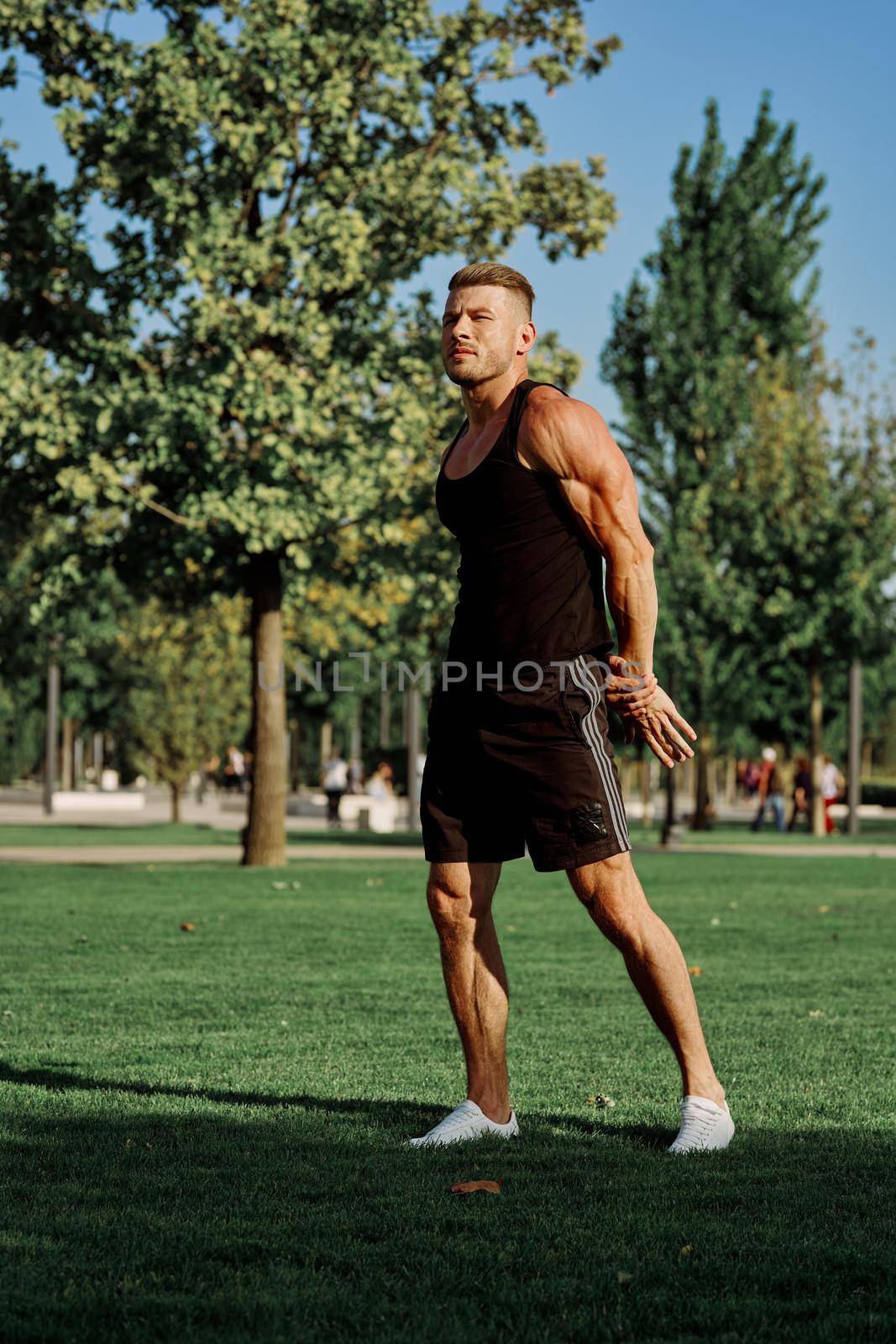 sports man in the park exercise fitness cardio. High quality photo