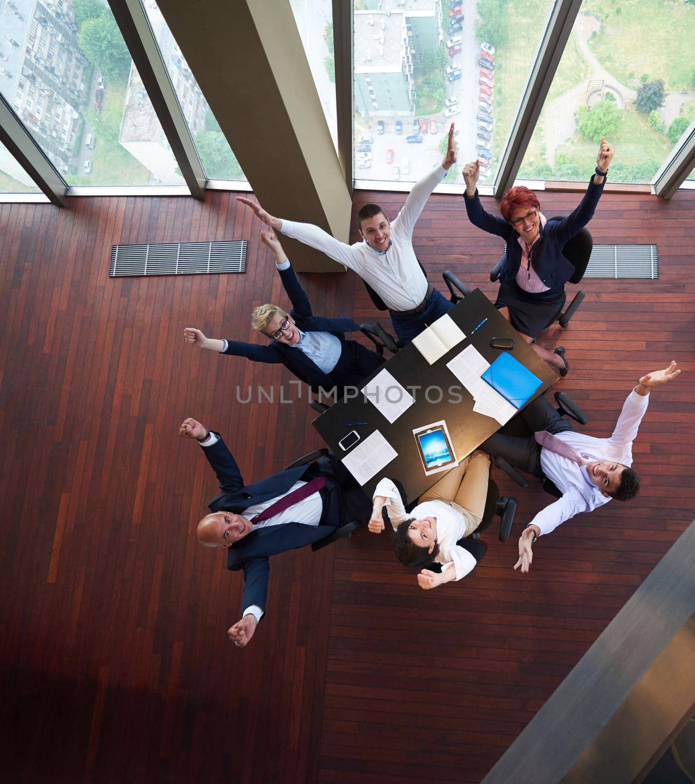 top view of  business people group on meeting throwing documents in air