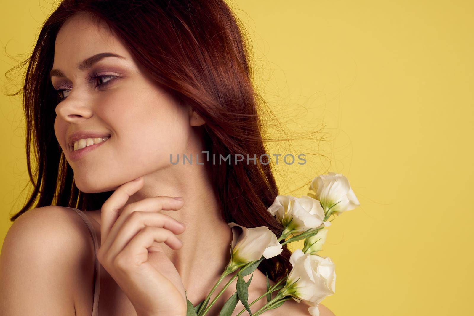 beautiful woman in dress posing flowers makeup isolated background. High quality photo
