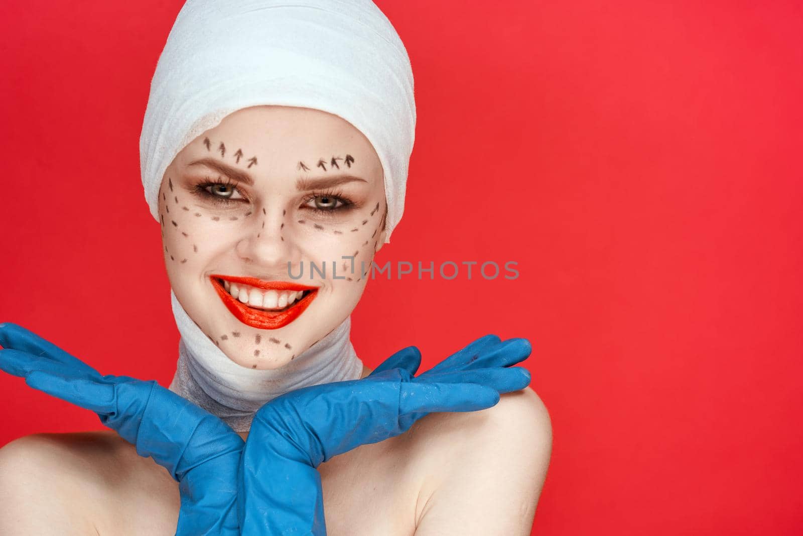 female patient aesthetic facial surgery clinic body care red background. High quality photo