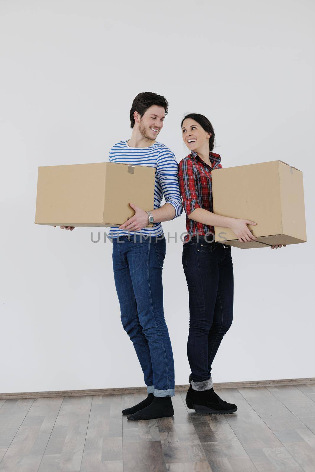 happy Young couple moving in new home