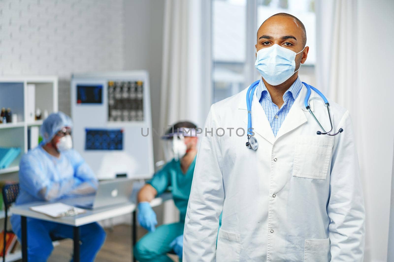 Portrait of african american doctor, hospital background by Fabrikasimf