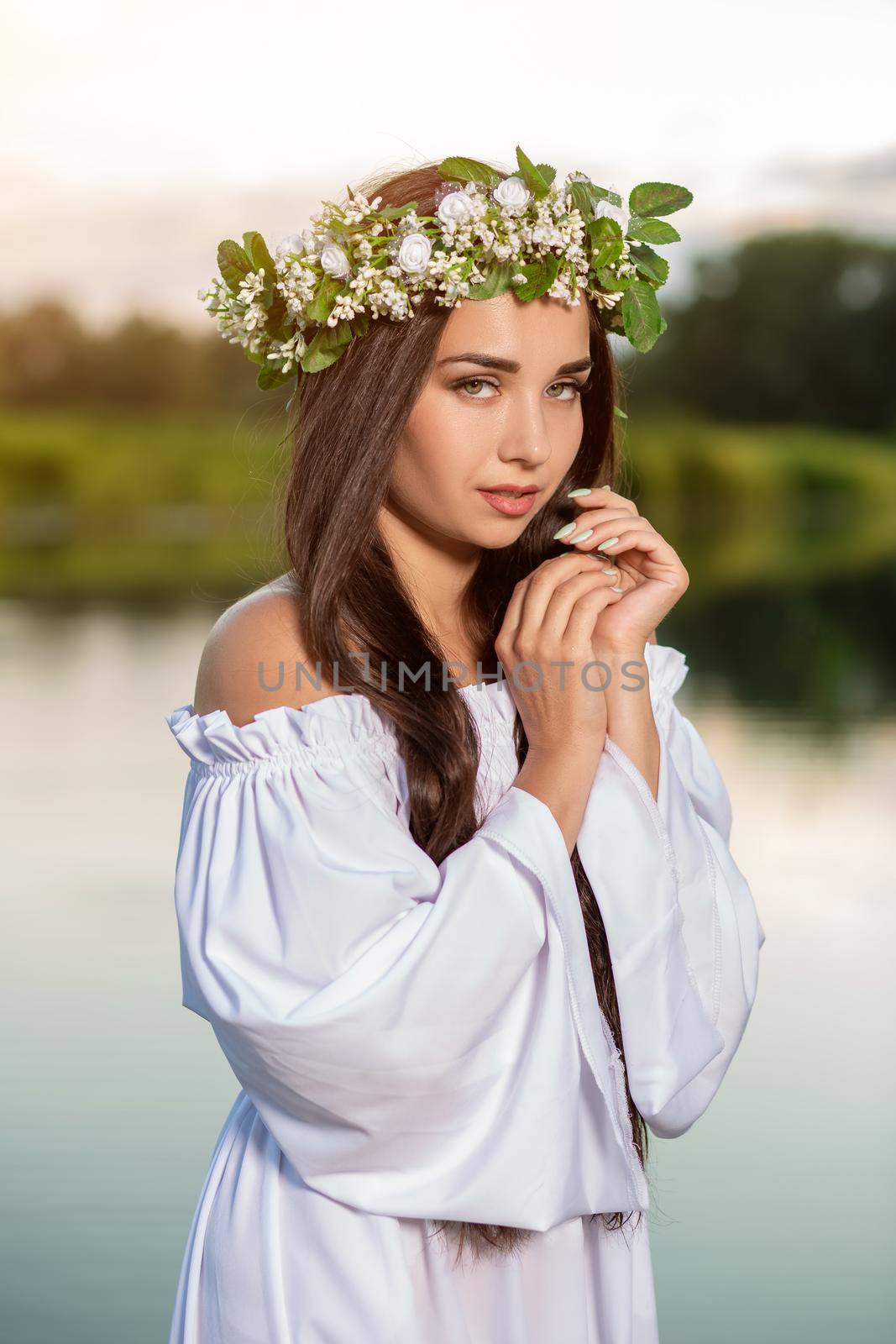Woman in white dress in the water. Art Woman with wreath on her head in river. Wreath on her head, Slavic traditions and paganism by nazarovsergey