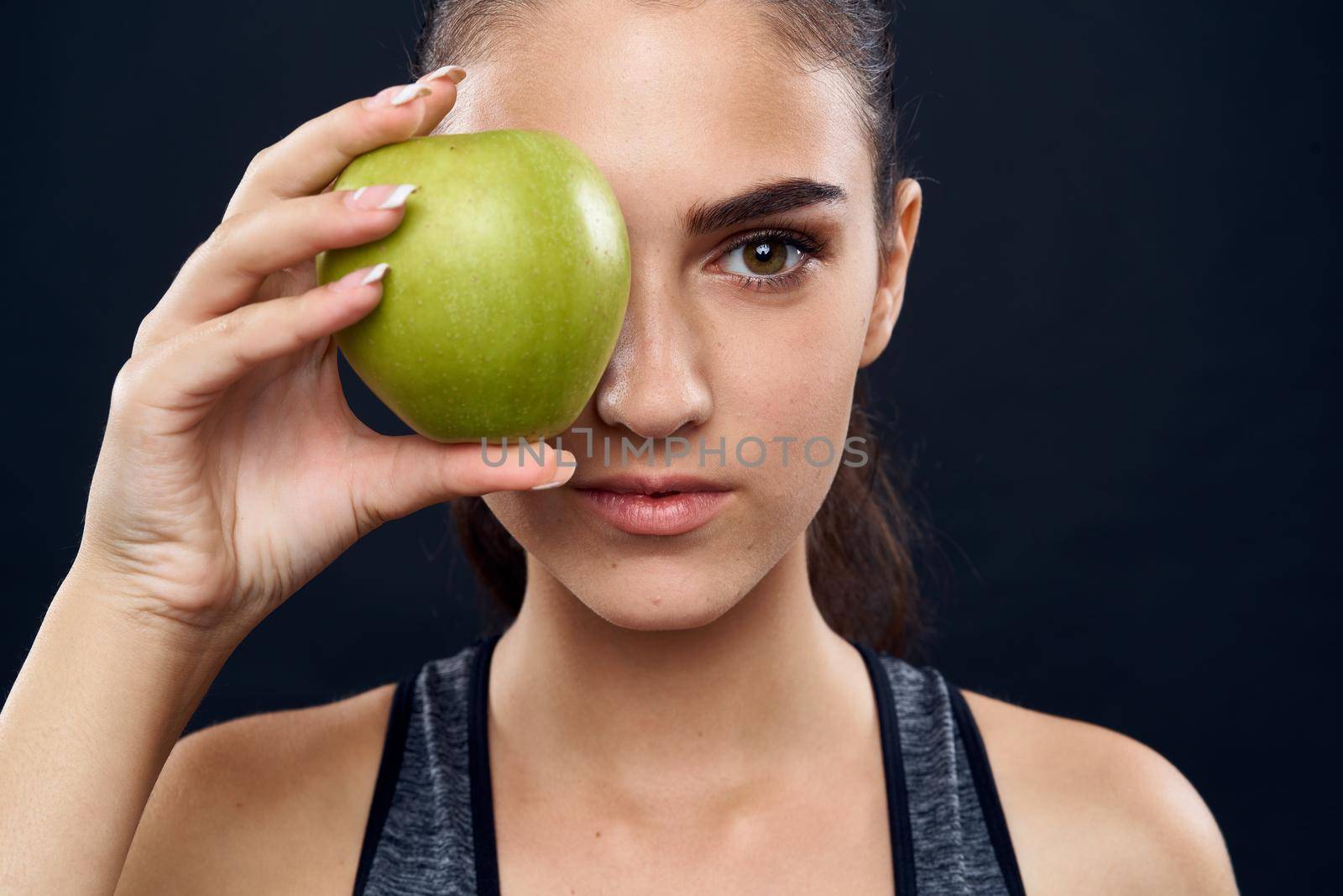 athletic woman slim figure green apple health. High quality photo