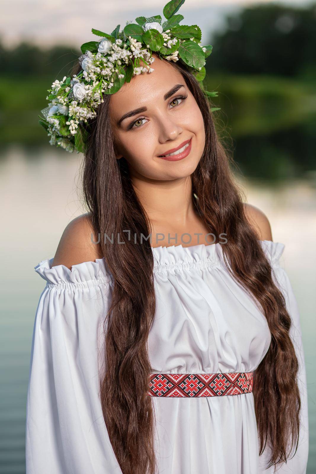 Woman in white dress in the water. Art Woman with wreath on her head in river. Wet witch Girl in the lake, mystical mysterious woman. Wreath on her head, Slavic traditions and paganism