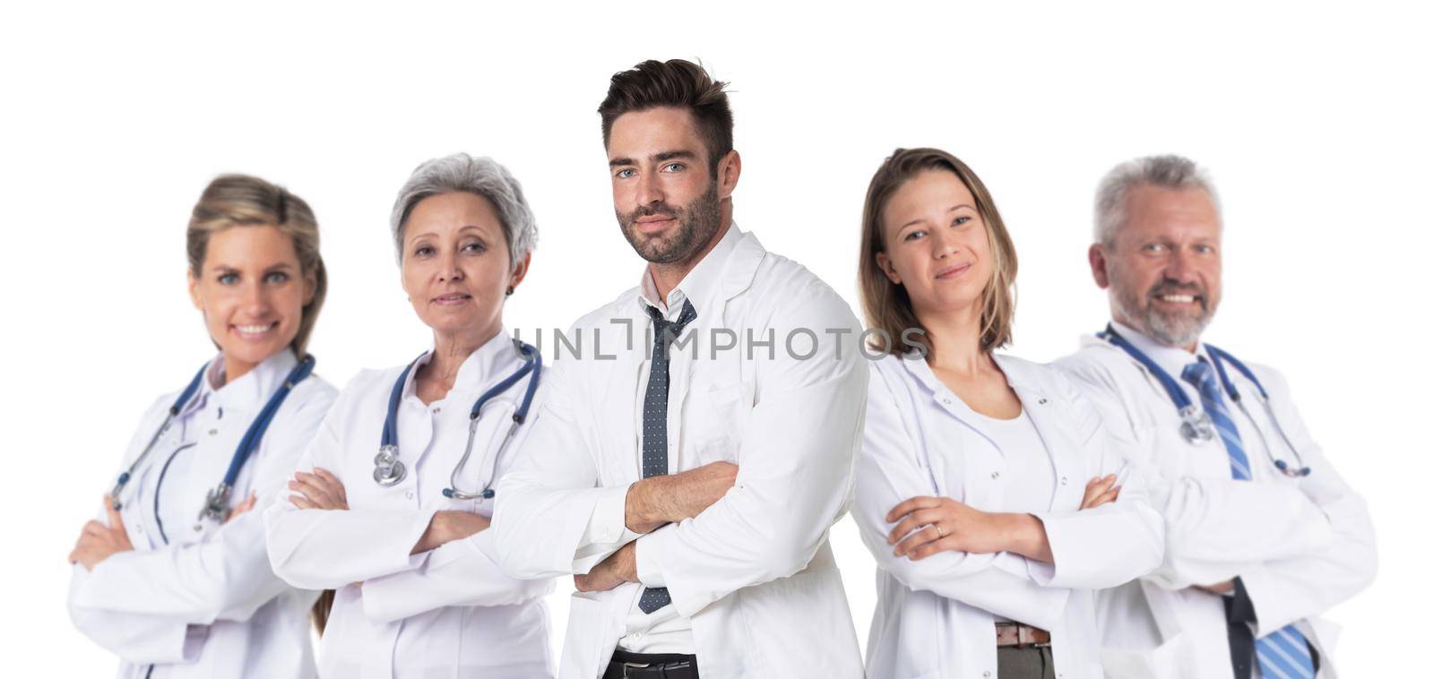 Team of successful medical doctors in labcoat uniform standing together with arms folded isolated on white background