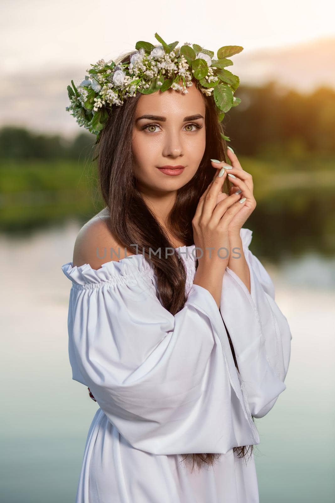 Woman in white dress in the water. Art Woman with wreath on her head in river. Wet witch Girl in the lake, mystical mysterious woman. Wreath on her head, Slavic traditions and paganism