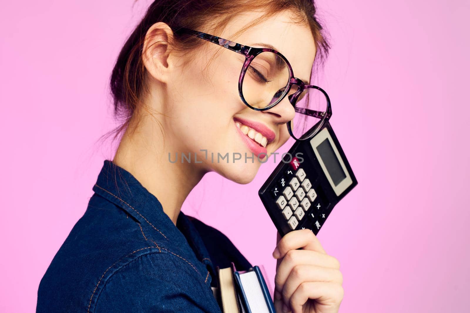 woman secretary with notepad and pencil office work pink background. High quality photo