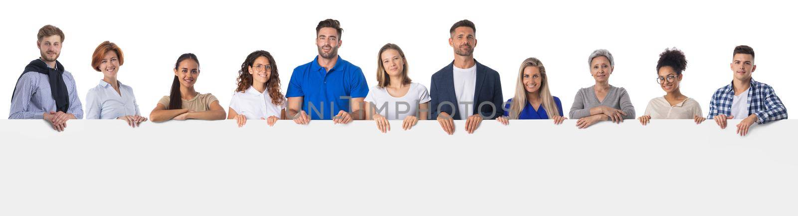 Large group of diverse people holding together blank sign with copy space for text