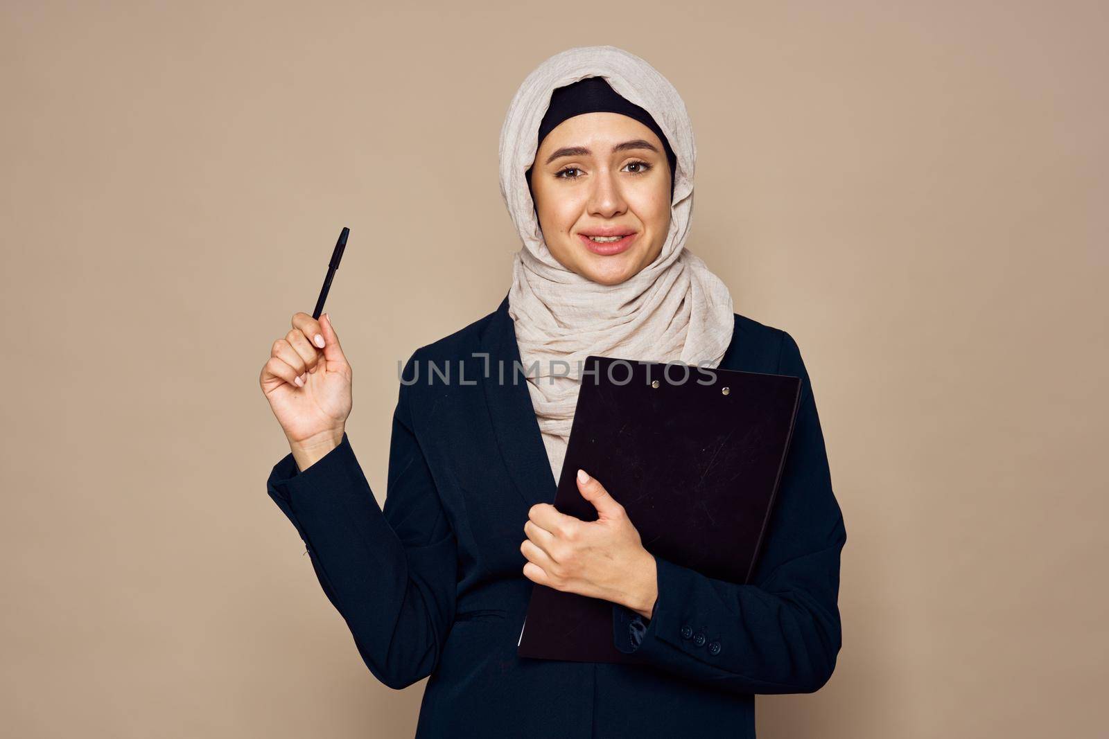 muslim woman with documents in hands office work business. High quality photo