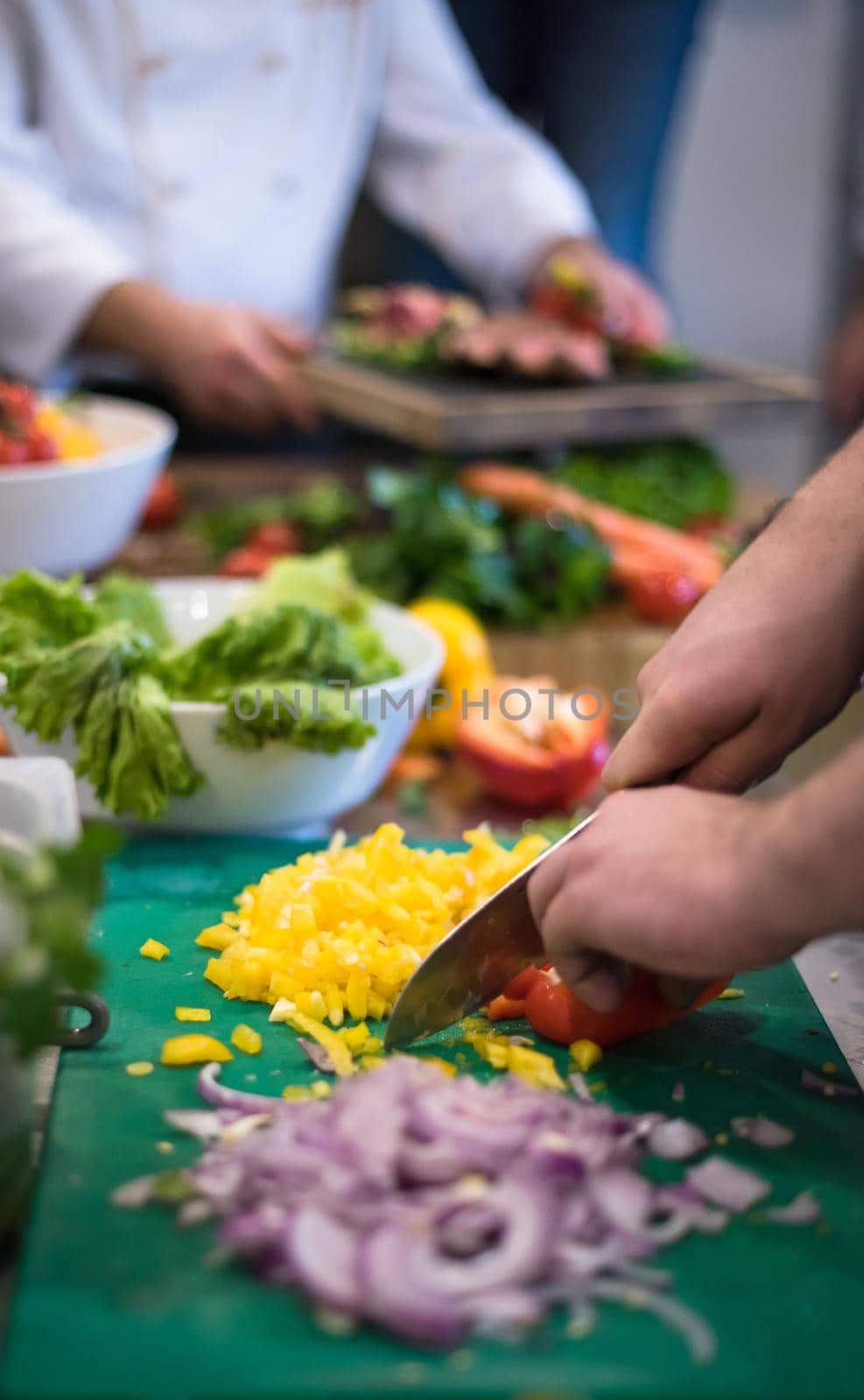 Chef hands cutting fresh and delicious vegetables for cooking or salad