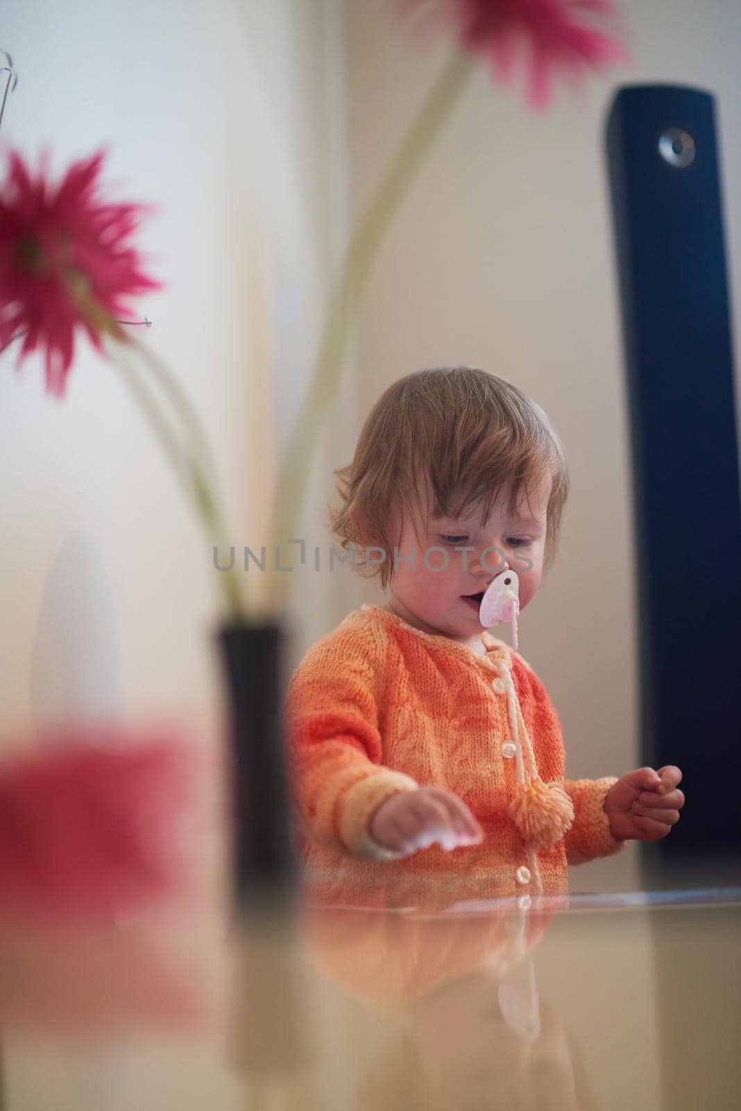 baby playing with tablet computer  at home