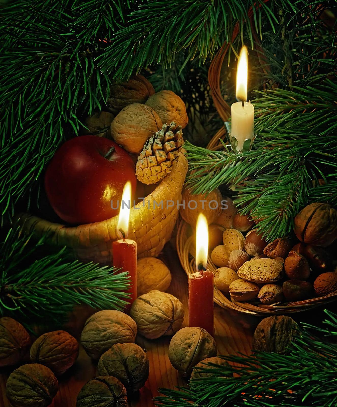 christmas still life with an apples,nuts and candles