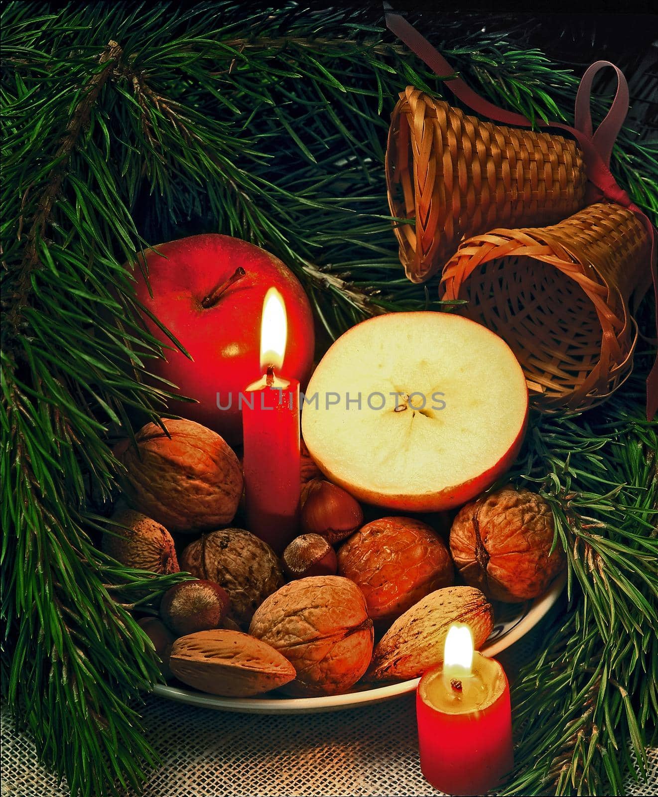 christmass still-life with nuts candels and apples