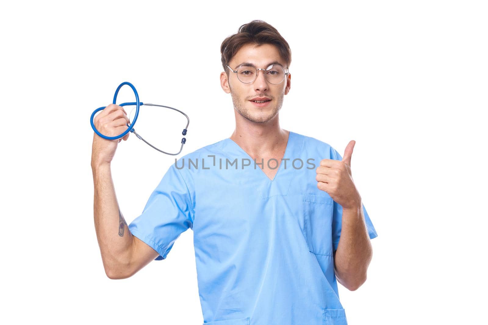 man in medical uniform health care treatment stethoscope examination studio lifestyle. High quality photo