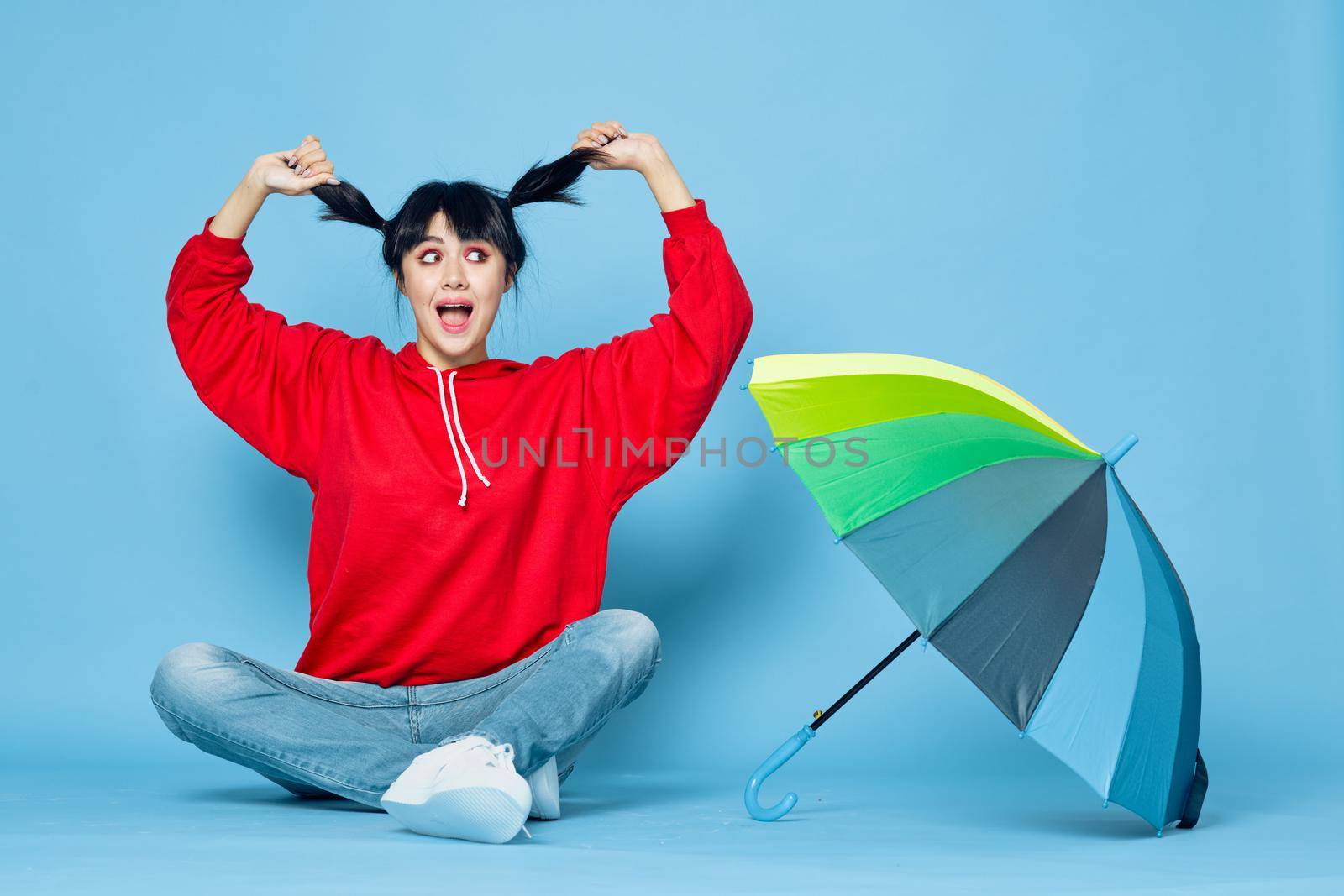 cheerful woman in red t-shirt rainbow color umbrella fashion by Vichizh