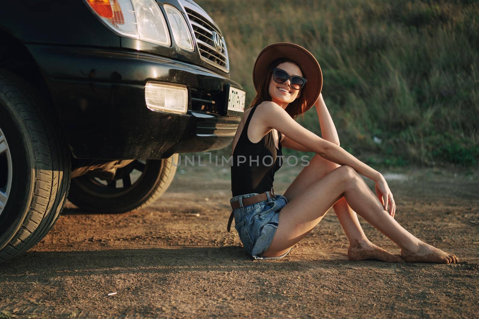 woman in sunglasses near car travel summer vacation landscape. High quality photo